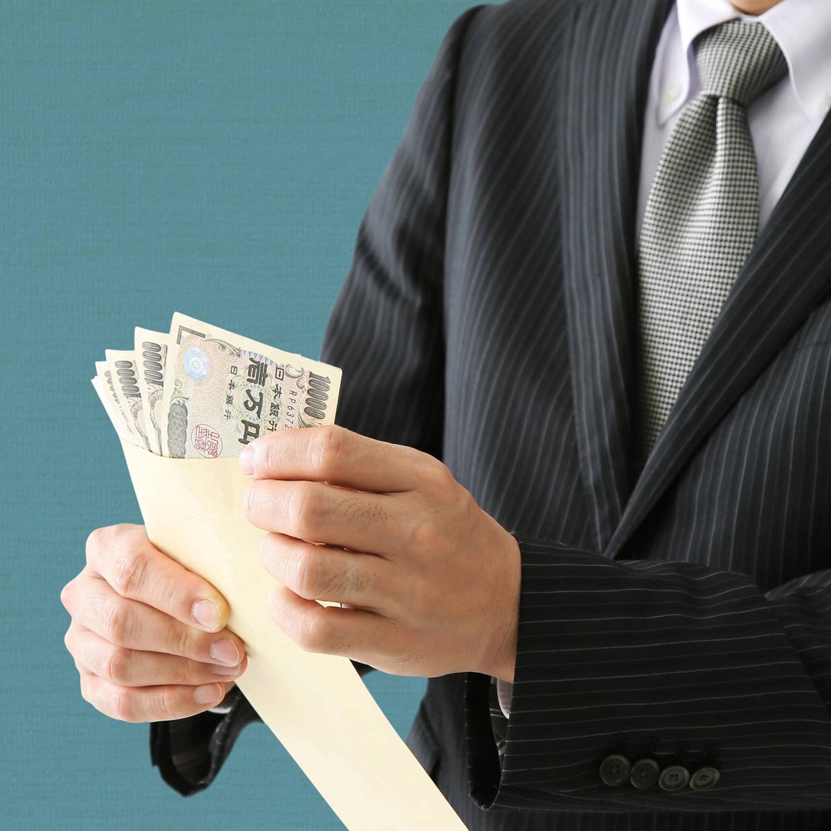 お金を数える人