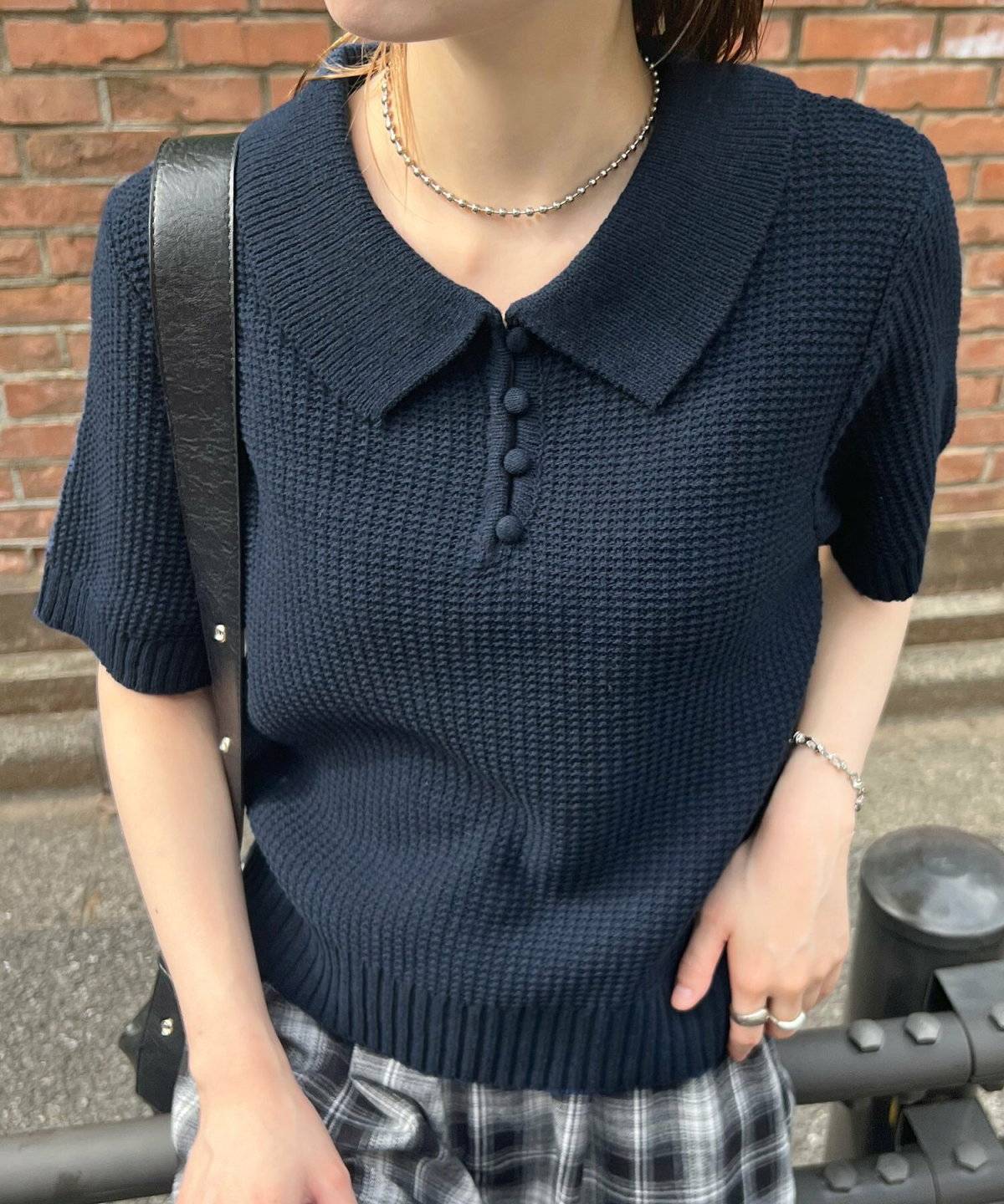 トラッドコーデの女性