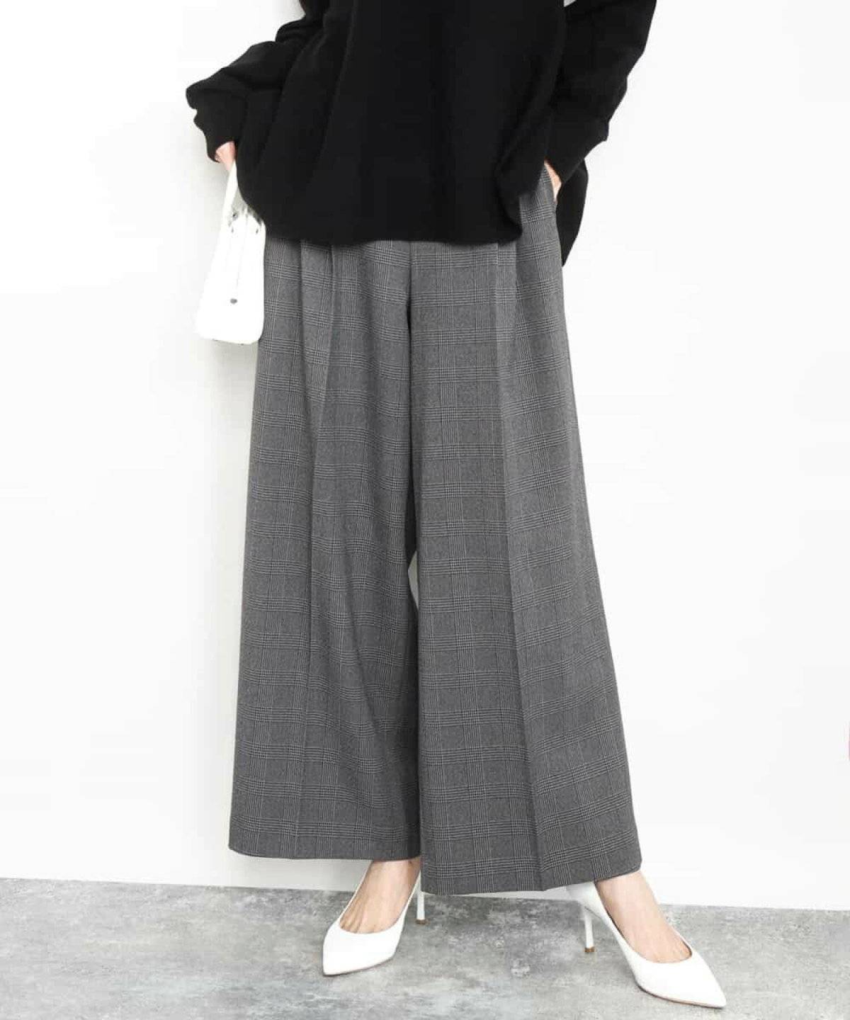 トラッドコーデの女性