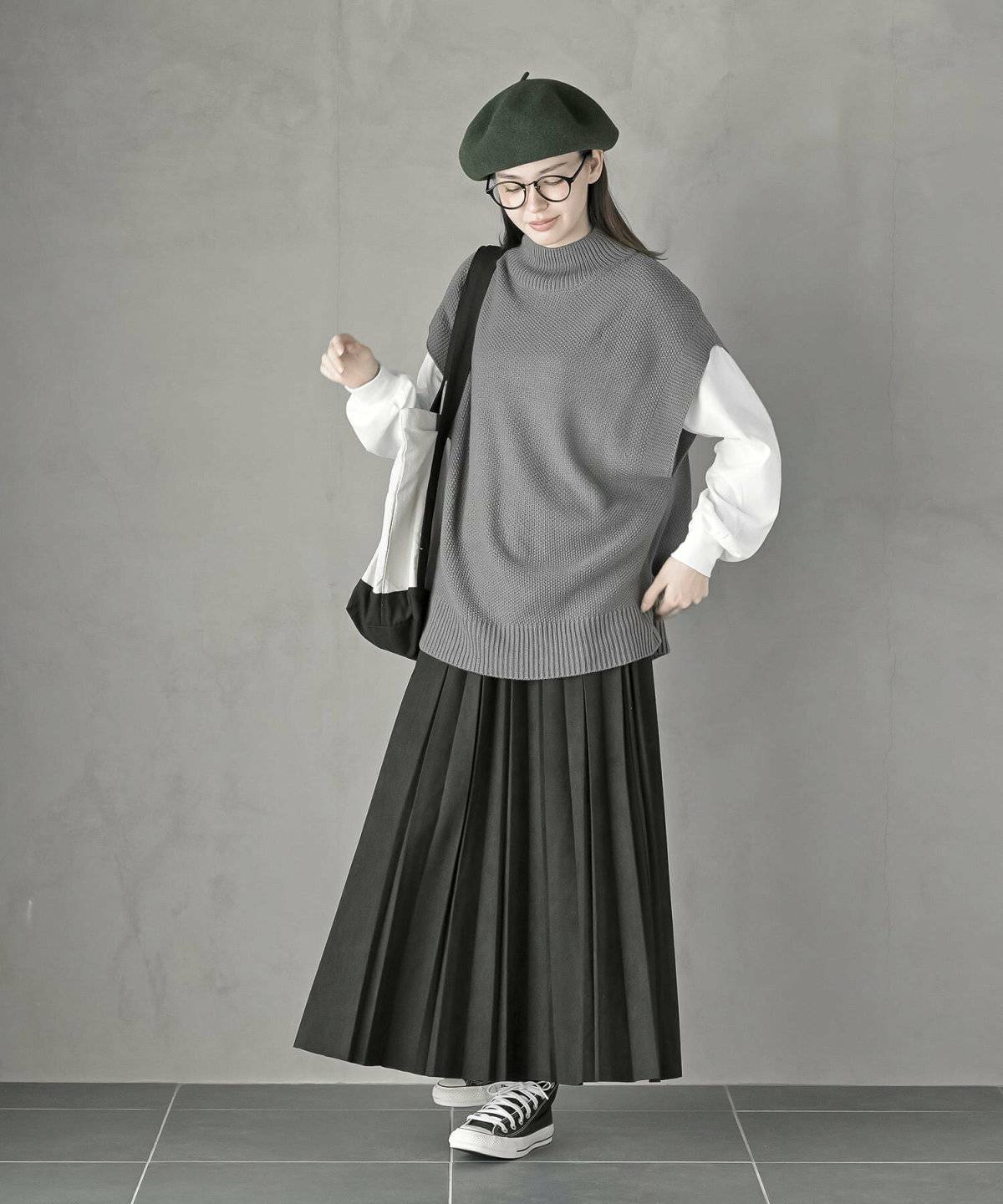 トラッドコーデの女性