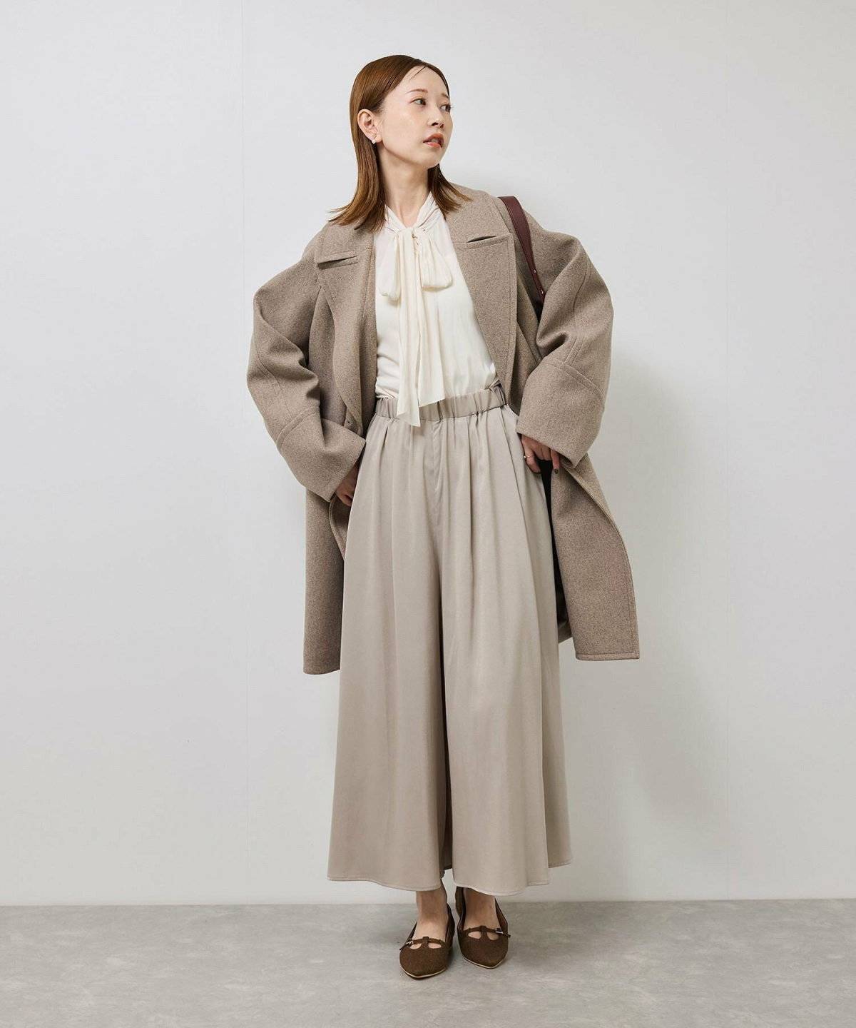 スカンツコーデの女性